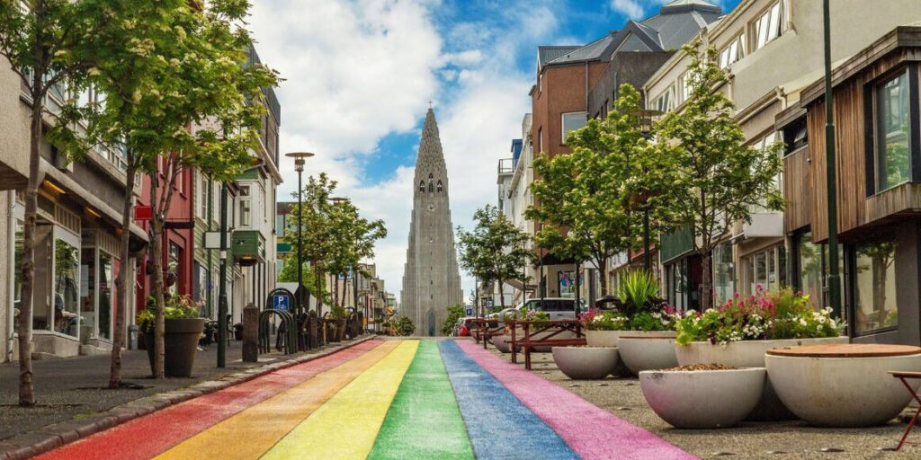 Colorful street with church in background